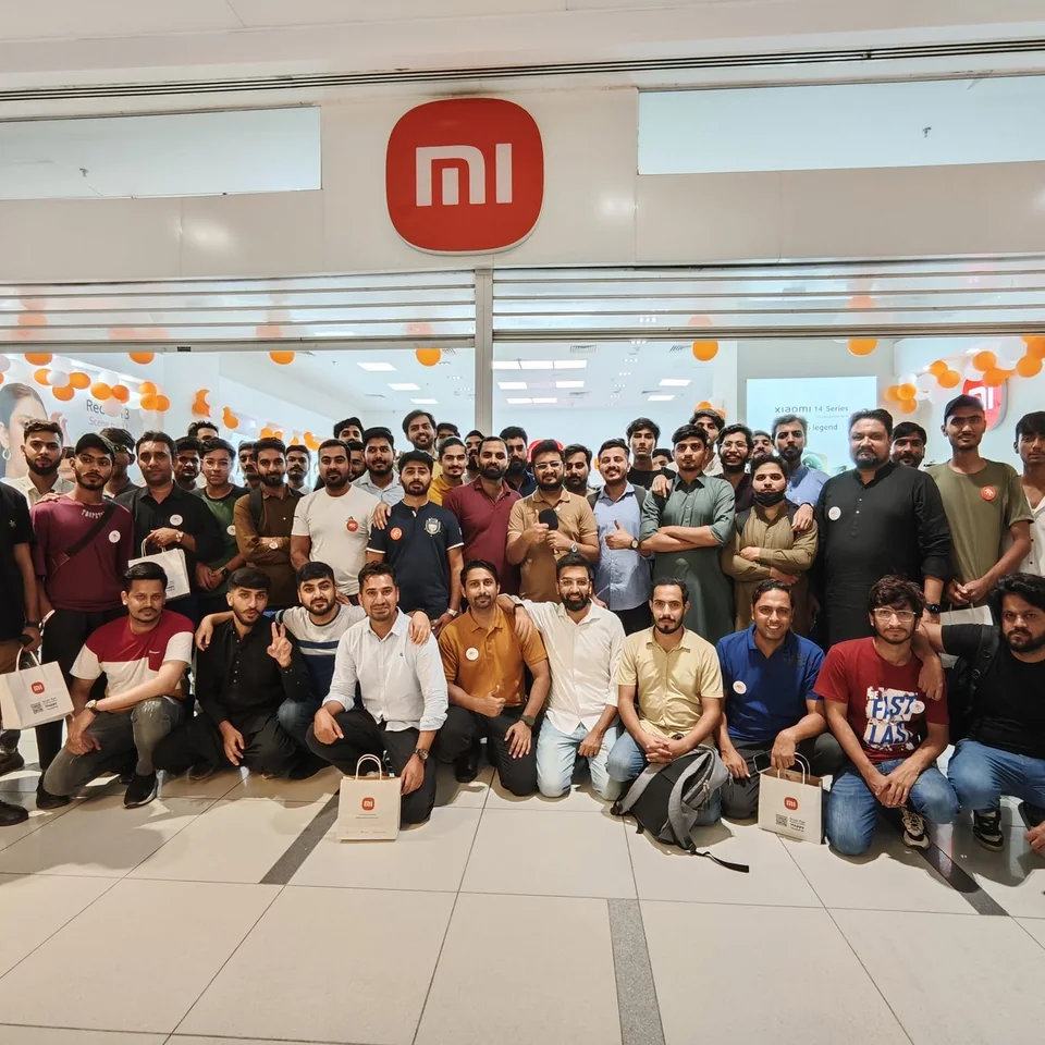 Crowd outside a Xiaomi store at a Redmi 13 launch
